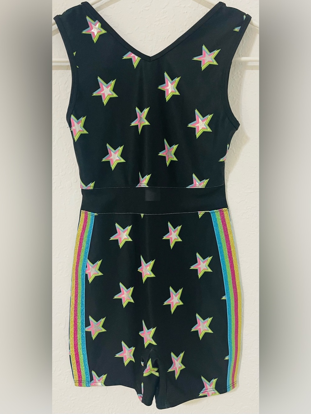 More Than Magic Black Star Print Romper with Rainbow Side Stripes